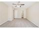 Bedroom featuring carpet, ceiling fan, and adjacent bathroom at 1107 Leslie Pl, Lithonia, GA 30058