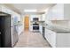 Spacious kitchen featuring white cabinets, granite countertops, and stainless steel appliances at 1107 Leslie Pl, Lithonia, GA 30058