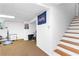 Finished basement area with stairs and partially visible gym equipment at 12550 Hutcheson Ferry Rd, Palmetto, GA 30268