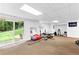 Finished basement with workout equipment and view to the backyard at 12550 Hutcheson Ferry Rd, Palmetto, GA 30268