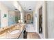 Luxurious bathroom with dual sinks, granite countertops, a soaking tub, and a separate water closet at 12550 Hutcheson Ferry Rd, Palmetto, GA 30268