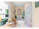 Soaking tub in an elegant bathroom with window and wood accents at 12550 Hutcheson Ferry Rd, Palmetto, GA 30268