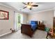 This bedroom features neutral colored walls and carpet, and a ceiling fan with light at 12550 Hutcheson Ferry Rd, Palmetto, GA 30268