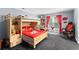 Spacious bedroom featuring a built-in bunk bed, carpet, and a large window at 12550 Hutcheson Ferry Rd, Palmetto, GA 30268