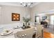 Bright dining room with wainscotting, chandelier, and decoratively set table at 12550 Hutcheson Ferry Rd, Palmetto, GA 30268