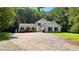 Charming two-story home with a basketball hoop, black shutters and a well-manicured lawn at 12550 Hutcheson Ferry Rd, Palmetto, GA 30268