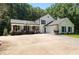 Charming two-story home with a basketball hoop, attached garage and meticulously maintained landscaping at 12550 Hutcheson Ferry Rd, Palmetto, GA 30268