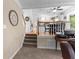 Hallway and partial view of kitchen shows the home's open floor plan at 12550 Hutcheson Ferry Rd, Palmetto, GA 30268