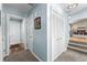 Hallway featuring hardwood floors and a closet with a louvered door at 12550 Hutcheson Ferry Rd, Palmetto, GA 30268
