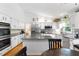 Open-concept kitchen featuring stainless steel appliances, an island and granite countertops at 12550 Hutcheson Ferry Rd, Palmetto, GA 30268