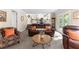 Comfortable living room with plush brown sofas, stylish decor, and a view into the bright kitchen at 12550 Hutcheson Ferry Rd, Palmetto, GA 30268