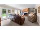 Cozy living room with fireplace, built-in shelving, and a view of the backyard at 12550 Hutcheson Ferry Rd, Palmetto, GA 30268