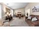 Cozy living room featuring plush furniture, neutral colors, and plenty of natural light at 12550 Hutcheson Ferry Rd, Palmetto, GA 30268