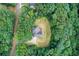 An aerial view of the home showcasing its private, wooded lot at 155 Skyview Dr, Social Circle, GA 30025