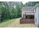 Backyard with a fenced yard, a home exterior and upper deck area at 155 Skyview Dr, Social Circle, GA 30025