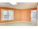 Finished basement features an egress window, plush carpeting, and access to the upper floors at 155 Skyview Dr, Social Circle, GA 30025