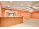 Finished basement with a wet bar, neutral carpet and vinyl flooring at 155 Skyview Dr, Social Circle, GA 30025