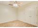 Bedroom featuring neutral carpeting, ceiling fan and double closet doors at 155 Skyview Dr, Social Circle, GA 30025