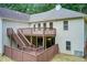 Exterior of home features a multi-level deck and stairs that lead to the backyard and lower level at 155 Skyview Dr, Social Circle, GA 30025