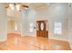 Inviting living room with large windows, hardwood floors, and a view into the dining area at 155 Skyview Dr, Social Circle, GA 30025