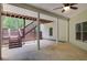Covered patio with concrete floor, ceiling fan, stairs to backyard and view of trees at 155 Skyview Dr, Social Circle, GA 30025