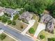 Stunning aerial view of the neighborhood homes, featuring lush greenery and manicured lawns at 390 Scott Farm Dr, Powder Springs, GA 30127