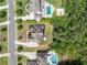 An aerial view showing homes and a pool, set amongst trees, highlighting the neighborhood's layout at 390 Scott Farm Dr, Powder Springs, GA 30127
