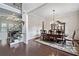 Elegant dining room with hardwood floors, chandelier, and a spacious dining table at 390 Scott Farm Dr, Powder Springs, GA 30127