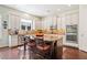 A modern kitchen with granite countertops, large island, and stainless steel appliances at 390 Scott Farm Dr, Powder Springs, GA 30127