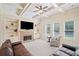 Comfortable living room features coffered ceiling, stone fireplace, and built-in shelving at 390 Scott Farm Dr, Powder Springs, GA 30127