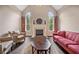 Inviting living room with vaulted ceilings, fireplace, and comfortable seating at 390 Scott Farm Dr, Powder Springs, GA 30127