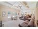 Spacious living room featuring a coffered ceiling, open floor plan, and large windows at 390 Scott Farm Dr, Powder Springs, GA 30127