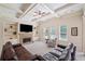 Bright living room with fireplace, coffered ceiling, and built-in shelves at 390 Scott Farm Dr, Powder Springs, GA 30127