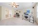 Spacious office with two desks, a ceiling fan, and double glass doors at 390 Scott Farm Dr, Powder Springs, GA 30127