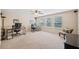 Spacious office space featuring multiple desks, a ceiling fan, and natural light at 390 Scott Farm Dr, Powder Springs, GA 30127