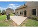 Outdoor patio area with a grill and seating, perfect for entertaining in the landscaped backyard at 390 Scott Farm Dr, Powder Springs, GA 30127
