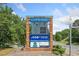 Sign at Harrison High School with digital displays, school sponsor information, and the school name at 390 Scott Farm Dr, Powder Springs, GA 30127