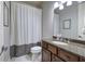 Bathroom featuring granite countertop and shower with privacy curtain at 16 Cambridge Way, Cartersville, GA 30121