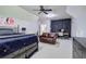Comfortable bedroom with a black feature wall, carpet, and a ceiling fan at 16 Cambridge Way, Cartersville, GA 30121