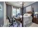 This bedroom features a four-poster bed, a ceiling fan, neutral walls, and a computer setup at 16 Cambridge Way, Cartersville, GA 30121
