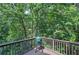 Wooden deck with a green egg grill and a green view at 16 Cambridge Way, Cartersville, GA 30121