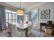 Inviting dining room with a wooden table and chairs, shuttered windows, and stylish decor, creating a cozy ambiance at 16 Cambridge Way, Cartersville, GA 30121