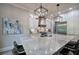 Kitchen with granite island, pendant lighting, and stainless steel appliances at 16 Cambridge Way, Cartersville, GA 30121