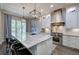 Bright kitchen with large island, stainless steel appliances, and pendant lighting at 16 Cambridge Way, Cartersville, GA 30121