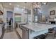Gourmet kitchen with a large island, stainless steel appliances, and ample counter space, perfect for cooking and gathering at 16 Cambridge Way, Cartersville, GA 30121
