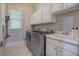 Laundry room with appliances, utility sink, and storage cabinets at 16 Cambridge Way, Cartersville, GA 30121