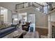 Open-concept living room with high ceilings, hardwood floors, a fireplace, and views into the dining room at 16 Cambridge Way, Cartersville, GA 30121