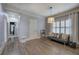 A living room with hardwood floors, a futon, a ceiling light, and natural light at 16 Cambridge Way, Cartersville, GA 30121