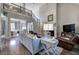 Spacious living room with a fireplace, hardwood floors, comfortable seating, and great natural light from the windows at 16 Cambridge Way, Cartersville, GA 30121
