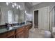Bathroom featuring double vanity, tile flooring, and glass-enclosed shower at 16 Cambridge Way, Cartersville, GA 30121
